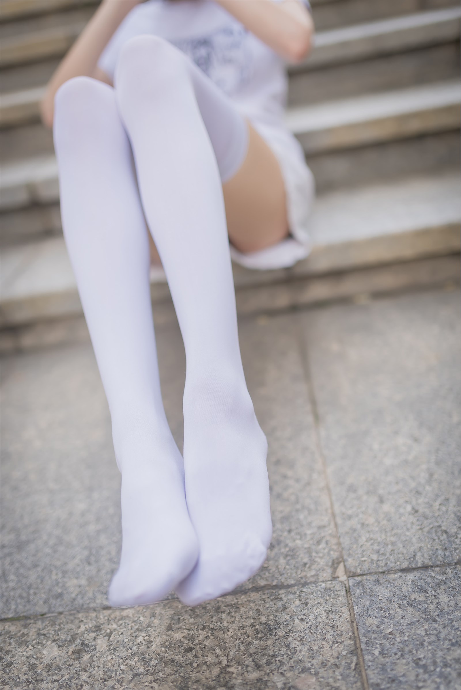 Rabbit plays with painted white stockings over the knee(4)
